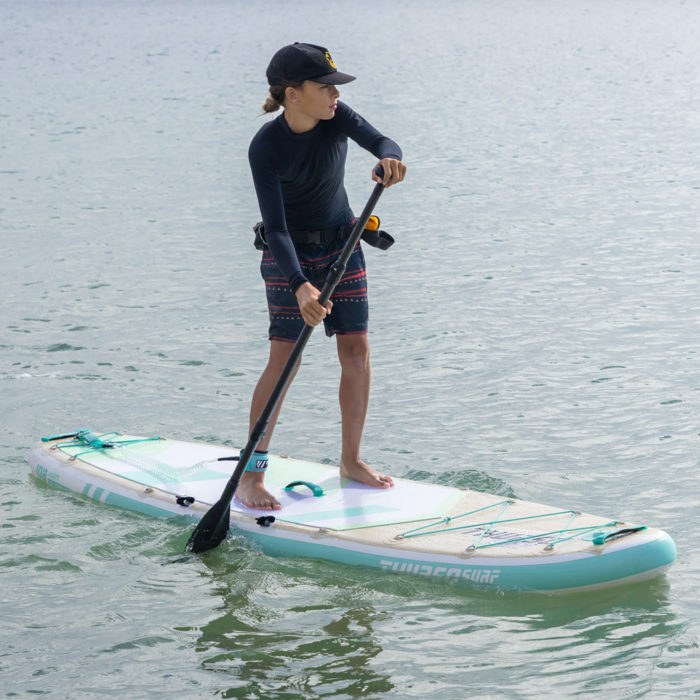 boy paddling on thurso surf adept paddle board
