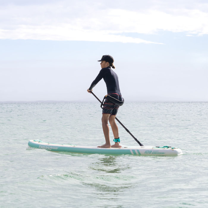 boy paddling on thurso surf adept paddle board looking forward