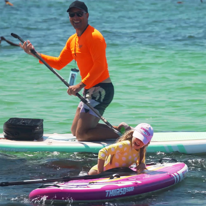 thurso surf prodigy magenta paddle board jumping on board