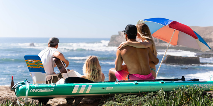 many people are siting on the thurso surf inflatable paddle board rest