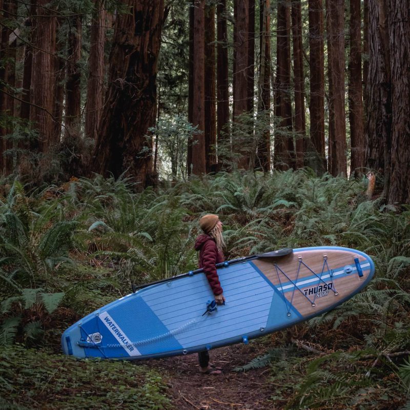 woman carrying waterwalker 126 dusk in woods