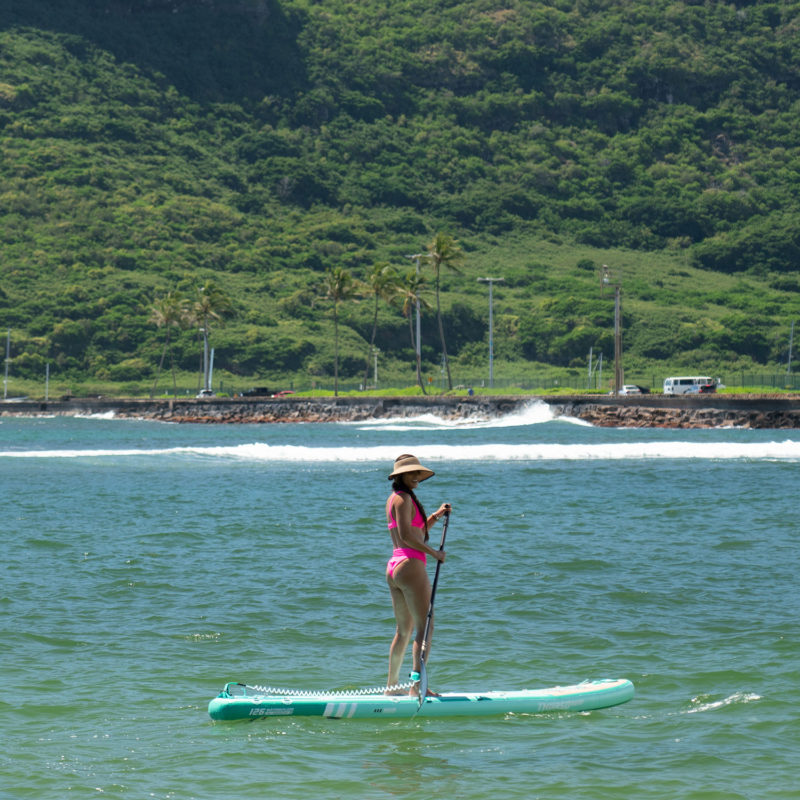woman paddling on waterwalker 126 paddle board turquoise